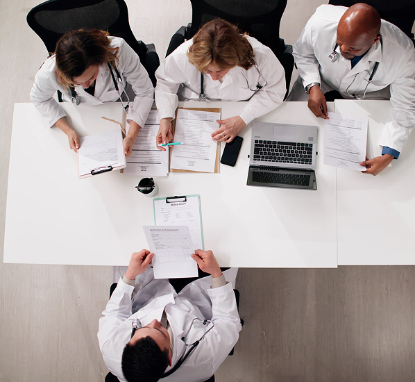 Doctors reviewing documents at a table
