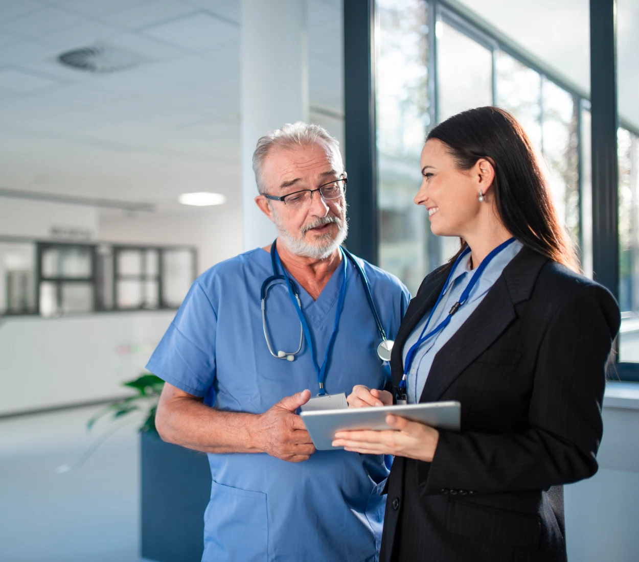 Medical professional consulting with businesswoman